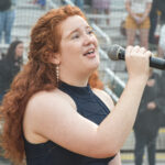 Singer Erin Woodward performing the National Anthem during the pre-game ceremony, June 04th, 2022